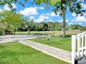 Lush backyard with a gravel path and lawn, offering a serene outdoor space at 1915 Quitman St, North Charleston, SC 29405
