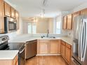 Well-lit kitchen with stainless steel appliances, wooden cabinets, and a functional layout at 311 Dupont Way, Summerville, SC 29485