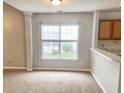 Bright room with neutral carpet, gray walls and a view of the outdoors through a window at 311 Dupont Way, Summerville, SC 29485