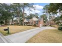 Beautiful brick home with a long driveway and well-maintained lawn at 315 Clubview Rd, Summerville, SC 29485