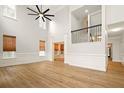 Open concept living room with tons of natural light and access to the stairwell at 317 Sabal Palmetto Ct, Moncks Corner, SC 29461