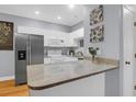 Bright kitchen featuring white cabinets, stainless steel appliances, and granite countertops at 4003 Radcliffe Place Dr # B6, Charleston, SC 29414