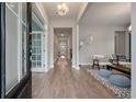 Inviting entryway with hardwood floors and modern lighting fixtures to welcome guests into the home at 4129 Maidstone Dr, Mount Pleasant, SC 29466