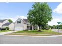 Charming two-story home with a well-manicured lawn, white garage door and black shutters at 428 Cabrill Dr, Charleston, SC 29414
