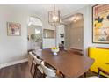 Elegant dining room featuring hardwood floors, stylish decor, and ample natural light at 465 Blue Dragonfly Dr, Charleston, SC 29414