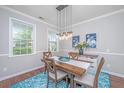Charming dining area with stylish decor and modern pendant lighting at 493 Nelliefield Trl, Wando, SC 29492