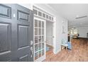 Inviting foyer features wood floors and an open view to the living spaces at 493 Nelliefield Trl, Wando, SC 29492