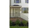 Close-up of the front entrance, showing brick steps, a black railing, and refined details at 5 Smith St, Charleston, SC 29401