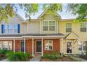 Charming townhouse exterior featuring brick accents and a welcoming entrance at 525 Tayrn Dr, Wando, SC 29492