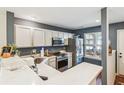 Modern kitchen with stainless steel appliances and stylish white cabinetry at 525 Tayrn Dr, Wando, SC 29492
