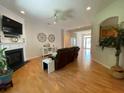 Inviting living room features hardwood floors, fireplace, and ample natural light at 7517 Whispering Oak Dr, Hanahan, SC 29410