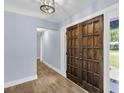 The foyer features hardwood floors, double doors, and a stylish light fixture at 809 O'Sullivan Dr, Mount Pleasant, SC 29464