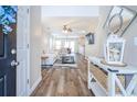 Bright entryway showcasing wood floors, a cozy living space, and an open floor plan at 1003 Washitonia Way # A, Charleston, SC 29492
