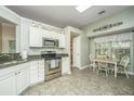 Bright kitchen with stainless steel appliances, granite countertops, and a charming breakfast nook at 104 S Ansel Xing, Goose Creek, SC 29445