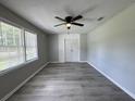 A bright room with plank flooring, a ceiling fan, and a built-in closet with double doors at 1102 Hampton Ct, Summerville, SC 29486