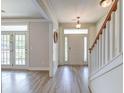 Bright foyer with hardwood floors, a staircase, and a front door with sidelights at 122 Foxglove Ave, Summerville, SC 29483