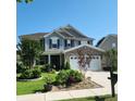 Gorgeous two-story home with attached garage and mature landscaping at 169 Woodbrook Way, Moncks Corner, SC 29461