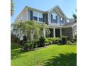 Charming home with beautiful landscaping and well-maintained lawn at 169 Woodbrook Way, Moncks Corner, SC 29461