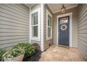 Close-up of the home's front entrance with a welcoming wreath and tiled porch at 331 Fish Creek Ct, Summerville, SC 29486