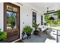 Inviting front porch featuring a swing, ceiling fan, and stylish decor at 3741 Juneberry Ct, Mount Pleasant, SC 29466