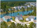 An aerial view of a beautiful home on the water surrounded by lush greenery at 393 Tupelo Lake Dr, Summerville, SC 29486