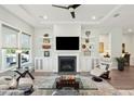Bright living room featuring a fireplace, custom built-ins, and elegant decor at 393 Tupelo Lake Dr, Summerville, SC 29486