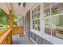 Cozy front porch showcasing stylish wood railings and a welcoming entrance to the home at 411 Berkeley Dr, Moncks Corner, SC 29461