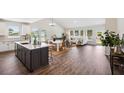 Spacious open-concept living space with a modern kitchen, dining area, and stylish living room at 453 White Magnolia St, Moncks Corner, SC 29461