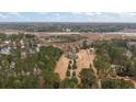 Aerial view of the property showcasing the large lot, water features and surrounding woods at 4689 Causey Pond Rd, Awendaw, SC 29429