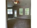 Large living room with neutral paint, carpet and plenty of natural light at 4804 Oak Haven Pl, Summerville, SC 29485