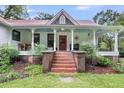 Charming house with red brick steps and a delightful front porch at 516 Hope Plantation Ln, Jacksonboro, SC 29452