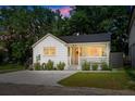Charming home featuring a well-manicured lawn and inviting front porch, showcasing classic curb appeal at 5814 Knight St, Hanahan, SC 29410