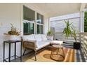 Inviting front porch featuring comfortable seating and stylish decor, perfect for relaxing outdoors at 5814 Knight St, Hanahan, SC 29410