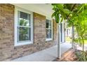 Charming front porch with brick facade and white columns at 680 Buckhall Ct, Mount Pleasant, SC 29464