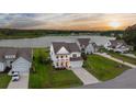 Stunning two-story home with a beautiful waterfront view and a manicured lawn at 682 Pontoon Rd, Huger, SC 29450