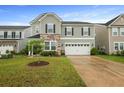 Beautiful two-story house with an attached garage and well-maintained lawn at 700 Silver Moss Dr, Moncks Corner, SC 29461