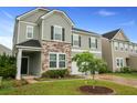 Charming two-story home with a manicured front yard and inviting curb appeal at 700 Silver Moss Dr, Moncks Corner, SC 29461