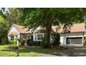 Beautiful home exterior showcasing lush landscaping and a convenient two-car garage at 1019 Royalist Rd, Mount Pleasant, SC 29464