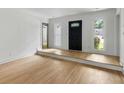 Bright and airy living room with hardwood floors, fresh white paint, and natural light from multiple windows at 1019 Royalist Rd, Mount Pleasant, SC 29464