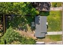 An aerial view of the home showing mature trees, the roof, and the spacious backyard with fencing at 109 Sawmill Dr, Summerville, SC 29483