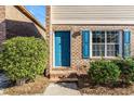 Close up of the front entrance showing a blue door and brick steps at 111 Elmwood Ave # A, Ladson, SC 29456