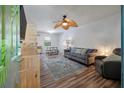 Cozy living room with comfortable seating, modern ceiling fan, and stylish decor accents at 1125 Oceanview Rd, Charleston, SC 29412
