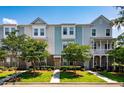Charming townhouse with a mix of siding and brick, enhanced by well-maintained landscaping at 114 Rowans Creek Dr, Charleston, SC 29492