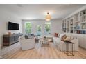 Inviting living room featuring a cozy seating area, bright windows, and modern furnishings at 114 Rowans Creek Dr, Charleston, SC 29492