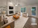 Inviting living room featuring a fireplace, built-in shelves, and ample natural light at 123 Lewisfield Dr, North Charleston, SC 29418