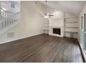 Spacious living room with a fireplace, built-in shelves, and staircase at 123 Lewisfield Dr, North Charleston, SC 29418