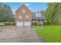 Charming brick home with two-car garage and manicured lawn at 125 Eston Dr, Goose Creek, SC 29445