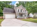 Inviting two-story home with a spacious driveway and attached garage, perfect for Gathering living at 206 Hawkridge Pl, Goose Creek, SC 29445