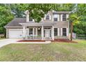 Attractive two-story home with white shutters and a covered front porch, exuding curb appeal at 206 Hawkridge Pl, Goose Creek, SC 29445