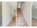 Inviting foyer boasts beautiful floors and a staircase leading to the upper level at 3073 Penny Ln, Johns Island, SC 29455